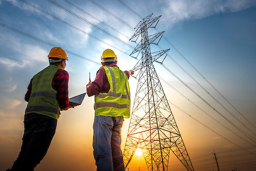 Picture,Of,Two,Electrical,Engineers,Using,A,Notebook,Computer,Standing